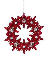 Ornaments shaped like a wreath. One is silver with red accents. One is red with silver accents.