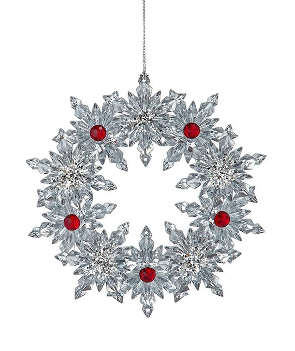 Ornaments shaped like a wreath. One is silver with red accents. One is red with silver accents.