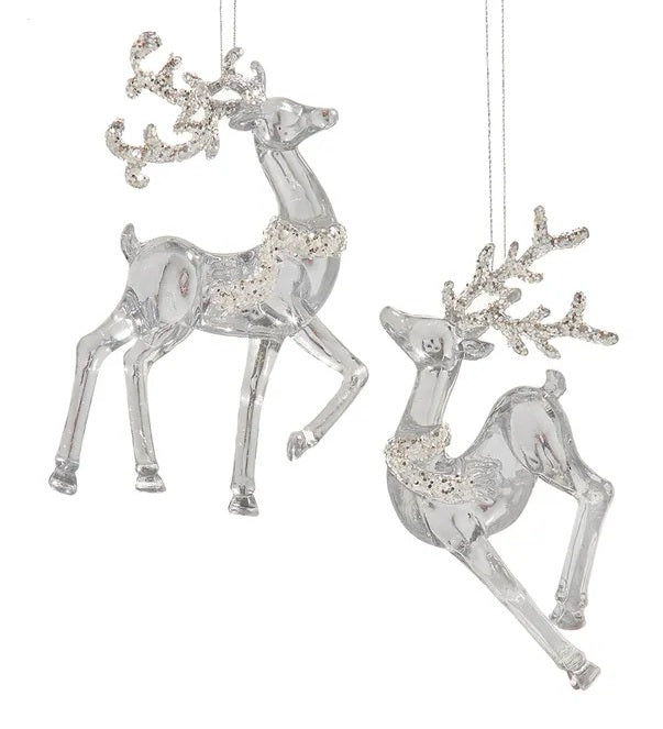 Transparent ornaments shaped like deer and covered in silver glitter.