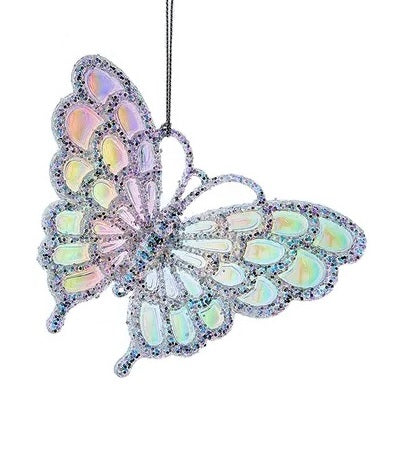 Butterfly shaped ornament decorated with opalescent, rainbow-themed designs with glitter.