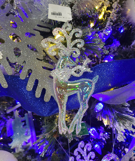 Shiny opalescent deer ornaments covered in glitter. One is standing and one is jumping.