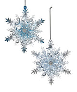 Ornaments shaped like snowflakes covered in blue and silver glitter.