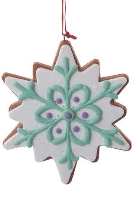 Ornament designed to look like a frosted gingerbread cookie. Two are shaped like six-point stars and two are shaped like snowflakes. They're all decorated with intricate designs. You get one, this image shows all four options.