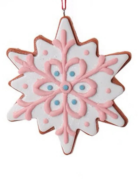 Ornament designed to look like a frosted gingerbread cookie. Two are shaped like six-point stars and two are shaped like snowflakes. They're all decorated with intricate designs. You get one, this image shows all four options.