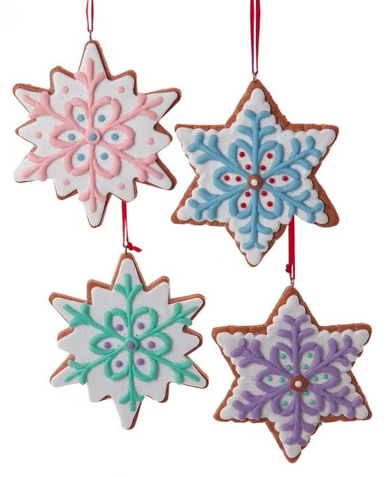 Ornament designed to look like a frosted gingerbread cookie. Two are shaped like six-point stars and two are shaped like snowflakes. They're all decorated with intricate designs. You get one, this image shows all four options.