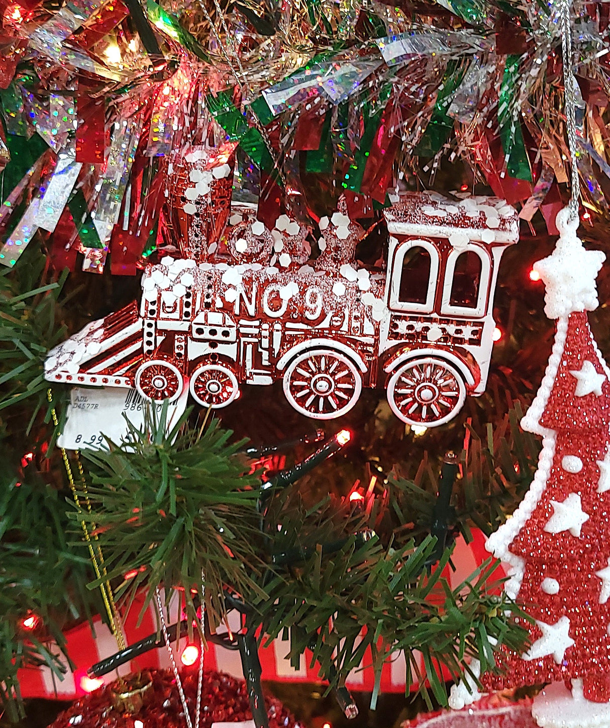 Red and white colored train ornament.