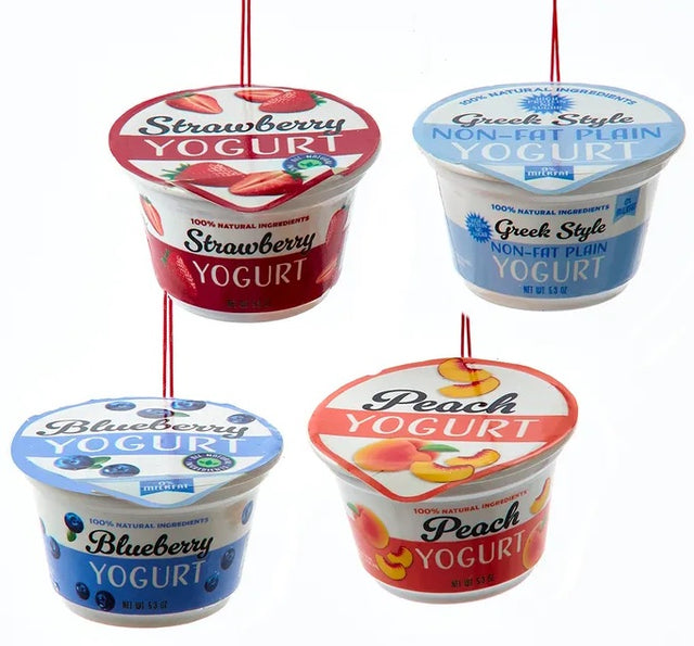 Ornament shaped like a cup of yogurt. One ornament is white and red and "flavored" strawberry. One ornament is white and blue and "flavored" blueberry. One ornament is white and orange and "flavored" peach. One ornament is white and blue and "flavored" Greek-style.