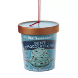 Ornaments shaped like a pint of ice cream. There are 5 options: Cookies & Cream, Strawberry, Chocolate, Vanilla or Mint Chocolate Chip. Each ornament features intricate details with a lifelike appearance, from the labels on the pint containers to the swirls of ice cream.