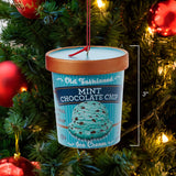 Ornaments shaped like a pint of ice cream. There are 5 options: Cookies & Cream, Strawberry, Chocolate, Vanilla or Mint Chocolate Chip. Each ornament features intricate details with a lifelike appearance, from the labels on the pint containers to the swirls of ice cream.