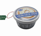 Plastic ornaments shaped like different party dips. One is a red container that reads "Classic Hummus." One is a green container that reads "French Onion Sour Cream Dip." One is a blue container that reads "Cream Cheese Spread."
