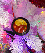 Plastic ornaments shaped like different party dips. One is a red container that reads "Classic Hummus." One is a green container that reads "French Onion Sour Cream Dip." One is a blue container that reads "Cream Cheese Spread."