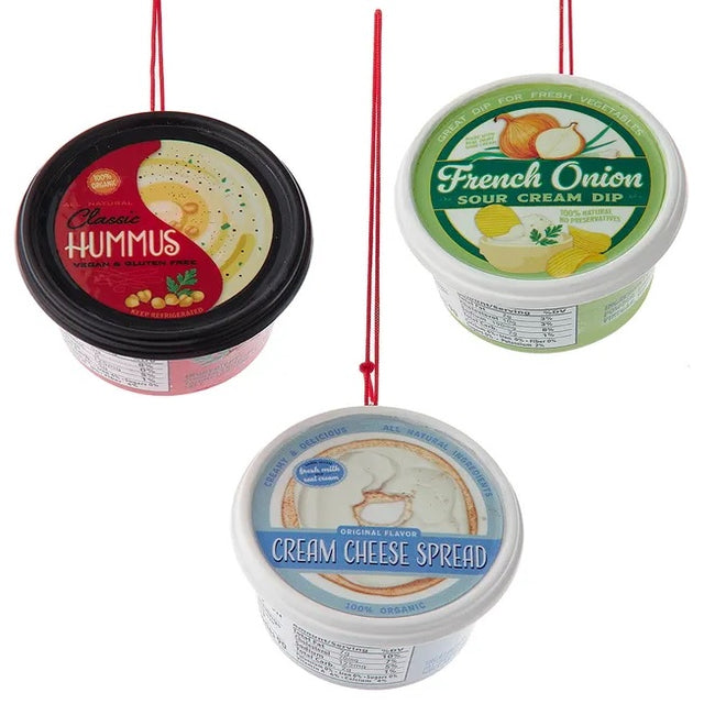 Plastic ornaments shaped like different party dips. One is a red container that reads "Classic Hummus." One is a green container that reads "French Onion Sour Cream Dip." One is a blue container that reads "Cream Cheese Spread."