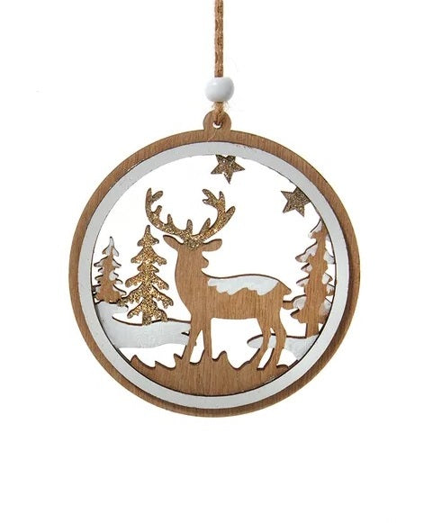 Round wooden ornament with a winter scene inside. One ornament features the silhouette of a reindeer standing in the middle of a snowy forest. One ornament features different types of snowflakes and the silhouette of a reindeer among some trees and it reads "Merry Christmas."