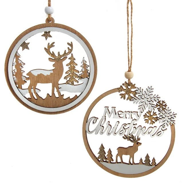 Round wooden ornament with a winter scene inside. One ornament features the silhouette of a reindeer standing in the middle of a snowy forest. One ornament features different types of snowflakes and the silhouette of a reindeer among some trees and it reads "Merry Christmas."