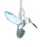 Acrylic ornament shaped like a bird. One has a blue tint and one has a pink tint. Both feature glitter accents.