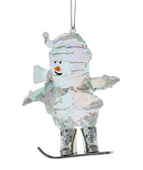 Opalescent snowman ornaments. This snowman is wearing winter clothes and is snowboarding.