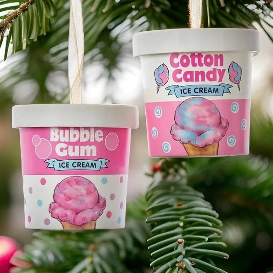 Ornaments shaped like an ice cream container. One container reads "Bubble Gum Ice Cream" and features pink, purple and blue polka dots. One container reads "Cotton Candy Ice Cream" and features white and blue swirls.