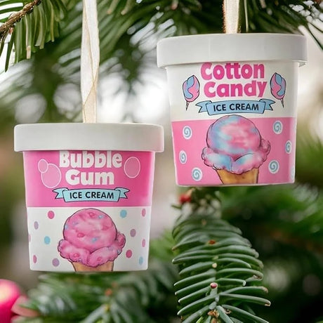Ornaments shaped like an ice cream container. One container reads "Bubble Gum Ice Cream" and features pink, purple and blue polka dots. One container reads "Cotton Candy Ice Cream" and features white and blue swirls.