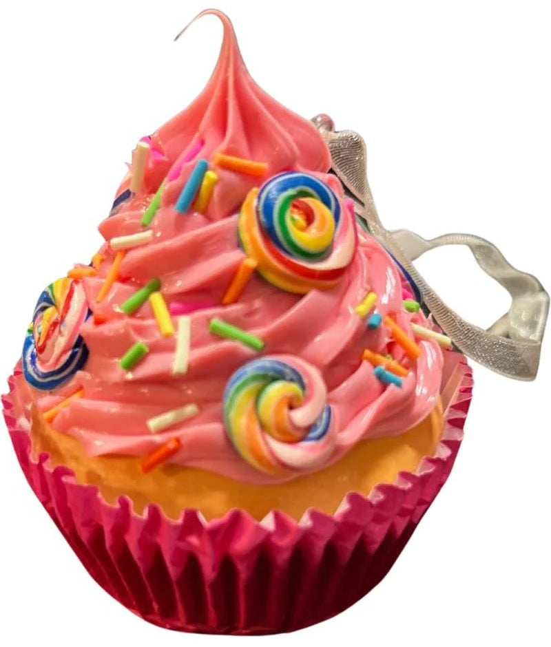 Christmas ornaments shaped like cupcakes with different colored frosting and candies on them.