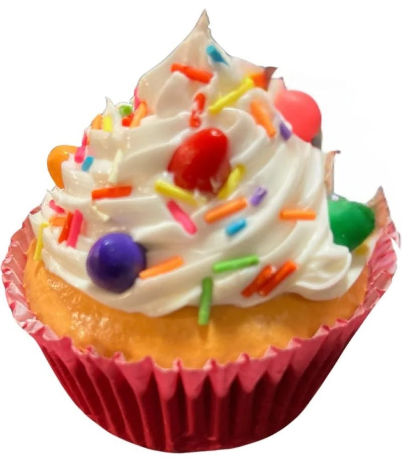 Christmas ornaments shaped like cupcakes with different colored frosting and candies on them.