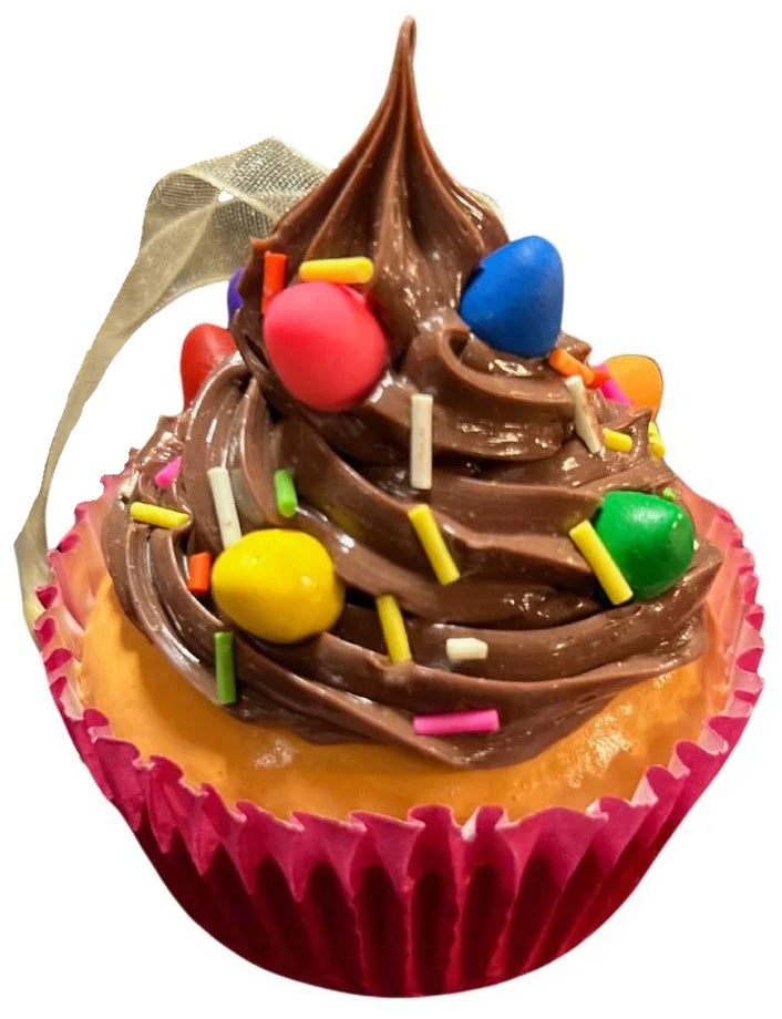 Christmas ornaments shaped like cupcakes with different colored frosting and candies on them.