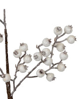 Pick spray designed to look like white berries on a brown stem.