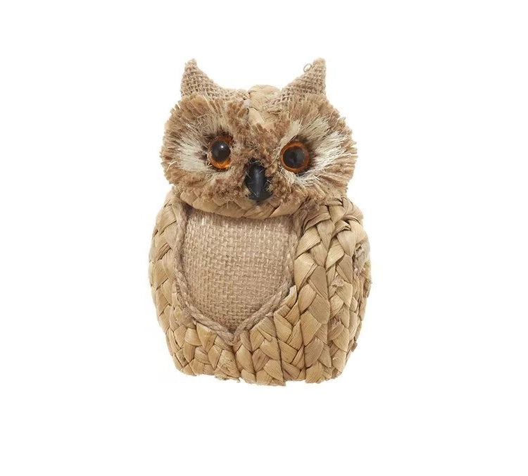 Ornament shaped like an owl with big, brown eyes.