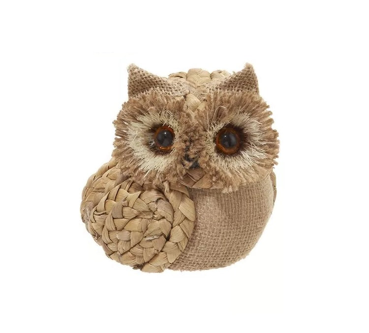 Ornament shaped like an owl with big, brown eyes.