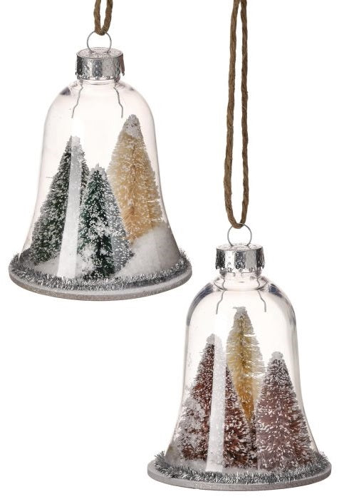 Ornament shaped like a glass bell with small bottle brush trees inside. One ornament features two green trees and one yellow tree. One ornament features two reddish brown trees and one yellow tree. All the trees are designed to appear covered in snow. Each ornament features tinsel around the border.