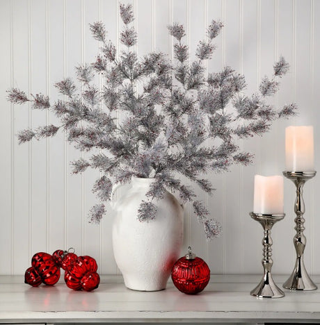 Silver pine spray with red flecks.