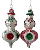 Snowman-shaped ornament. One snowman is wearing a red top hat and a green scarf. One snowman is wearing a green top hat and a red scarf. Both ornaments feature a striped design on the bottom half.