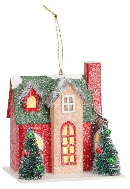 Christmas ornament shaped like a house. Colors are red, green, tan and white.