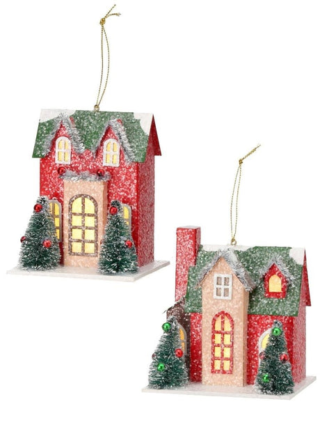 Christmas ornament shaped like a house. Colors are red, green, tan and white.