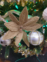 Tan colored pick spray designed to look like a poinsettia with tan colored buttons in the center.