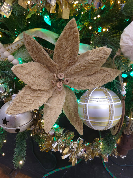 Tan colored pick spray designed to look like a poinsettia with tan colored buttons in the center.