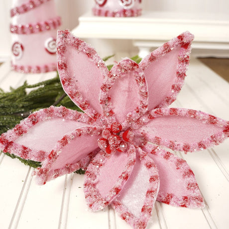 Pick spray designed to look like a poinsettia made out of pink and red candy.