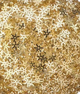 Ball ornament covered in gold snowflake shaped sequins.