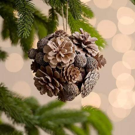 Ornament consisting of a bunch of different sized/colored pine cones.