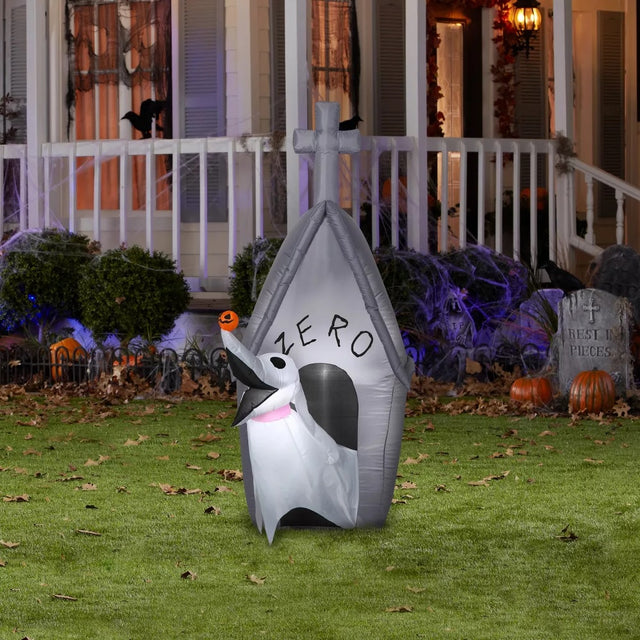 Halloween inflatable shaped like the character Zero from The Nightmare Before Christmas, emerging out of his doghouse. Zero has a tiny, carved pumpkin on his nose.