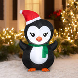 Christmas inflatable designed to look like a cute penguin wearing a Santa hat and a green scarf.