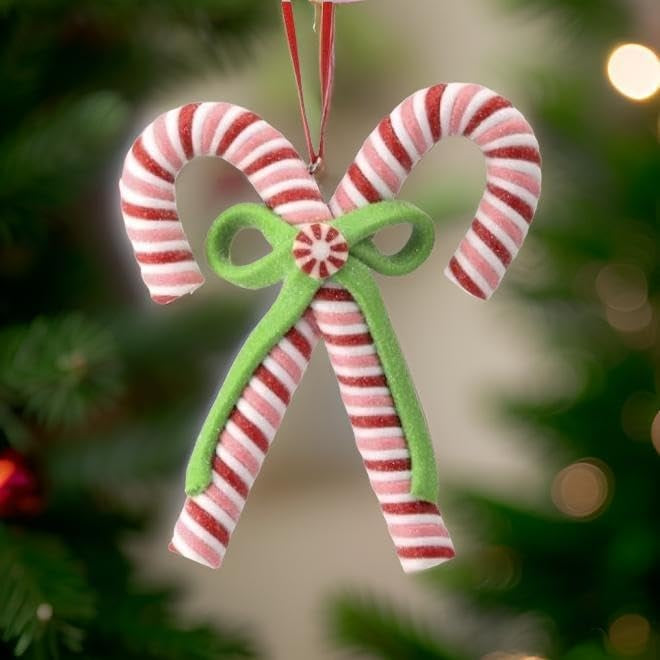 An ornament shaped like two red, white and pink candy canes tied together with a green bow.