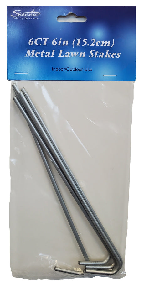 This image shows the packaging that these metal lawn stakes comes in. It reads "Sienna. Color of Christmas. 6 count 6 inch metal lawn stakes. Indoor/Outdoor use." The bag is see-through and the silver metal stakes are visible.