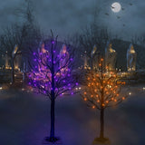 LED decorations for Halloween. One is a 4 ft. black wire tree with orange lights. The other is a 5 ft. black wire tree with purple lights.