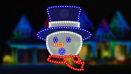 Outdoor LED decoration shaped like a Snowman head. He's wearing a blue top hat, has a blue eyes and a blue mouth, an orange carrot nose and a red scarf. The mouth and eyes move.