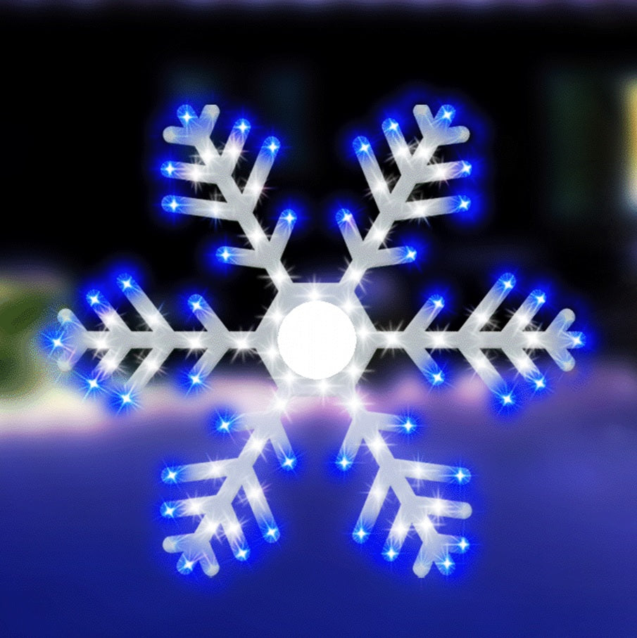 Outdoor LED decoration shaped like a snowflake. It's lit with blue and pure white lights.