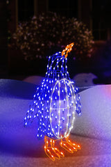 Outdoor LED wire sculpture shaped like a standing penguin. Pre-lit with blue, pure white and orange lights.