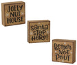 Square shaped holiday sign. One sign reads "Jolly Nut House." One sign reads "Santa Stop Here!" One sign reads "Better Not Pout."