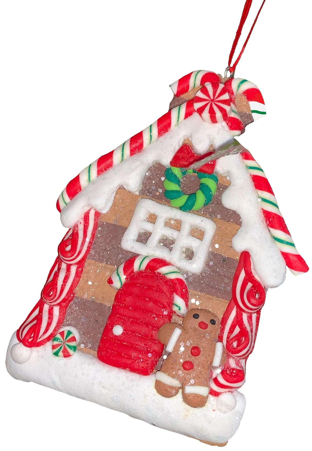 This ornament was designed to look like a gingerbread cookie house covered in sugar. This specific ornament has long red, green and white candy canes on the roof and features a gingerbread man on the right side of the front door.