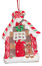 This ornament was designed to look like a gingerbread cookie house covered in sugar. This specific ornament has long red, green and white candy canes on the roof and features a gingerbread man on the right side of the front door.