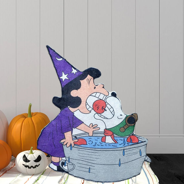 Lighted Halloween decoration. Looks like Lucy and Snoopy from the Peanuts cartoons bobbing for apples. Lucy is dressed in a pointed, purple hat and dress. Snoopy appears to be dressed as a pilot. Snoopy is inside the small water tub.